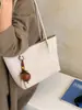 Bolso de mano de nicho de alta gama estilo coreano transfronterizo para mujer 2026 bolso cuadrado pequeño bolso de hombro bolso de mano casual de gran capacidad