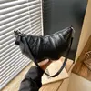 Modelo nuevo 2026 transfronterizo, bolsa de dumplings francesa de nicho simple y versátil para mujer, bolso de hombro y bandolera moderno y a la moda