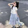 Verano 2026 Nuevo Estilo Camisa Polo Manga Corta Estilo Universitario Coreano para Niñas Falda de Encaje Dulce y Linda Conjunto de Dos Piezas