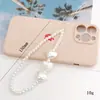 Cadena para teléfono de perlas estilo Chanel Colgante de flor pequeña Cordón para teléfono Funda para teléfono Accesorio con cuentas Cadena anticaídas para mujer