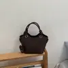 Bolso Cubo Estilo Coreano de Nicho para Mujer Verano 2026 Nuevo Bolso de Mano de Moda Bolso Cruzado para el Trabajo y el Trayecto Bolso de Hombro Simple