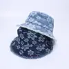 Nuevo sombrero de pescador de mezclilla japonés y coreano moda sombrero de sol con flores venta al por mayor 2024 primavera y verano protector solar ala ancha sombrero tipo cubeta transfronterizo