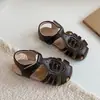 Sandálias Romanas Trançadas com Tira para Dedos 2026 Novo Verão Estilo Coreano Sapatos Vazados de Princesa para Meninas para Usar com Saias Sandálias de Praia