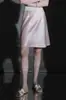 Saia de cetim de acetato 73,7%, versão curta, elegante e feminina, barra em cauda de peixe, saia curta evasê para mulheres, nova para o verão