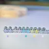2026 Verano Nuevo Dopamina Super Brillo Estrella Diamantes de Imitación Acero de Titanio Roscado Aretes de Presión Apilables para Mujer Coloridos Estrella de Cinco Puntas Ear Cuff