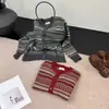 Chaqueta suéter de rayas retro para mujer, nueva moda de otoño 2026, cárdigan de punto versátil, top elegante y con estilo