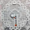 Llavero de acrílico de doble cara con texto de caqui, lindo, creativo y práctico, pequeño regalo, colgante de anillo de alambre