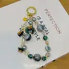 Pingente de Celular Borboleta Flor com Contas de Cristal, Corrente de Pulso Elegante e Doce de Abóbora com Toque de Luxo, Abóbora de Cristal