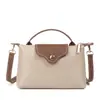 2026 Novo Modelo Design de Nicho Retro Casual Bolsa de Ombro Formato Bolinho Moda Tendência Elegante Bolsa Transversal de Mão