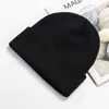 Venta al por mayor del fabricante Gorro cálido de moda para otoño e invierno, Gorro de punto a prueba de frío, Color sólido para exteriores, Protección para las orejas, Gorro de lana, Logotipo bordado