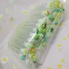 Pincel de mascara de tubo transparente de dibujos animados mezcla de colores mini de dibujos animados lindo independiente con tubo pincel de mascara de pestañas peine pequeño en stock