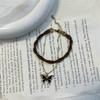 Collar con colgante de mariposa y cadena de cuero estilo Maillard para otoño e invierno, cadena de clavícula ligera de lujo para mujer.