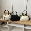 Bolso de mano simple de comercio exterior para mujer, nuevo modelo 2026, bolso cruzado de gran capacidad para el día a día, bolso pequeño ligero para exteriores y ocio
