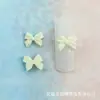 0.8 * 1cm moño colorido Mini tamaño pequeño decoraciones para arte de uñas corbata de moño DIY aretes accesorios