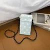 Bolsa de teléfono tejida color caqui de diseño nicho de verano para mujer, nuevo estilo 2026 bolso pequeño cuadrado de paja, bolso de hombro y cruzado