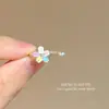 Anillo apilado de flores de color suave estilo coreano, diseño de nicho, versátil, ajustable, personalidad única, anillo de dedo para mujer