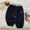 Otoño 2026 Nuevas Llegadas Ropa Infantil Niños Niñas Patchwork Bloque de Color Bordado Casual Pantalones Deportivos Pantalones Largos para Bebé Modernos