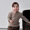 Chaleco de Plumón para Niña Otoño e Invierno 2026 Nuevo Modelo Ligero Cálido para Bebé Conjunto de Tres Piezas Ropa Exterior Versátil para Bebé