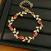 Elegantes y exquisitos pendientes y collar de hoja y flor tachonados de diamantes, cadena para la clavícula de lujo ligero de nicho de alta gama, juego de joyería versátil