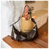 Bolso tipo bolsa de dumpling plisada de alta gama para mujer 2026, con un diseño retro y único, un bolso de hombro de gran capacidad que se puede llevar debajo del brazo