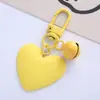 Nuevo llavero de color caramelo con forma de campana de amor, lindo para chica, corazón de chica, corazón de melocotón, funda para auriculares, colgante para bolso, en stock, venta al por mayor