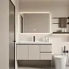 Gabinete de baño de roble estilo crema, diseño de lujo ligero y simple, combinación de gabinete de espejo inteligente, gabinete con lavabo de cerámica integrado