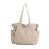 Nova bolsa de lona lavada unissex estilo japonês 2026, bolsa de ombro de grande capacidade, adequada para homens e mulheres, e pode ser usada como bolsa de mão para estudantes levarem para a aula