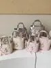 Bolso grande de alta capacidad transfronterizo 2026, bolso texturizado de alta gama, bolso cubo coreano de nicho para mujer
