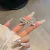 Nuevo producto coreano: Pinza para el pelo de lazo plateado, pinza lateral linda y delicada para flequillo para niñas, accesorio para el cabello de alta gama y exquisito