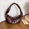 Bolsa de Mão Feminina Nova de Outono 2026 Estilo Vintage Nicho Bolsa de Ombro Transversal Bolsa de Bolinho Elegante de Alta Qualidade