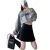 Falda plisada de uniforme JK de cuatro estaciones nueva de venta al por mayor + cremallera + botón falda versátil falda corta