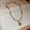 Collar de piedra de ojo de tigre artificial chapado en oro real, cadena de suéter Joker de nicho Maillard, joyería retro de alta gama al por mayor