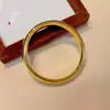Mismo estilo que Puzuo Gold Shop pulsera de círculo liso con espalda de locha dorada brillante para mujer simple sensación de alta gama pulsera sólida anillo de mano de boda
