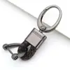 Llavero de coche de cuerda trenzada de cuero nuevo para fabricantes, simple, aleación de zinc para hombre, patrón de colgar en la cintura, hebilla de cabeza grande, cordón