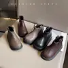 Botas de cuero de moda para niñas 2026 otoño e invierno nuevas botas cortas retro para niños suela blanda versátiles de caña baja botas de motorista Martin