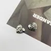 Nuevos Accesorios de Corazón Cruzado Joyería Personalizada Estilo Oscuro Parche de Aleación Hecho a Mano Accesorios para el Cabello Flores para Zapatos Materiales DIY