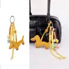 Venta al por mayor de fábrica Ins Retro Perro Salchicha Colgante para Bolso Serie Miu Cachorro Cuerda Trenzada Hecha a Mano Llavero de Pareja Cordón