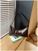 Bolso de axila de diseño de nicho versátil de alta gama, nuevo modelo transfronterizo, bolso de hombro casual vintage simple, bolso para el trabajo