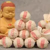 Té Pu'er crudo al por mayor Mini Tuo pequeño té de árbol antiguo brote de nieve Tuo té brote de nieve Bola de Dragón té 500g