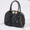 Bolso tipo concha estampado para mujer 2026 nuevo bolso de hombro decorativo casual mini bolso pequeño con colgante bolso de mano de moda