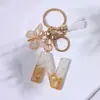 Llavero Colgante de Borla con Letra Inglesa Personalizada de Purpurina Blanca con Resina Epoxi y Colgante de Resina con Pan de Oro, Llavero Sencillo
