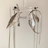 Diseño de nicho textura plateada aretes largos con borla de sauce temperamento inteligente joyería de oreja de lujo nuevo chino venta al por mayor