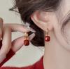 Pendientes festivos de Año Nuevo con diseño de nicho de aguja de plata para mujer, con viento rojo, pendientes de moda de alegría segura al por mayor