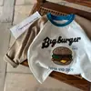 Camiseta de manga larga de algodón puro para niños y niñas, camiseta base de dibujos animados bordada con flock para niños 2026, adecuada para primavera y otoño