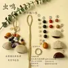 Kit de material DIY para fazer um móbile de casca de fruta, um sino pendurado de cura, com frutas pretas indonésias, estramônio, lírio d'água e rotim
