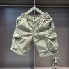 Bermuda Cargo Casual Masculina para o Verão 2026 com Múltiplos Bolsos, Corte Solto, Algodão Puro Elástico, Comprimento de Cinco Pontos para Uso ao Ar Livre