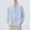 Camisa de manga larga 2026 moda primavera y otoño camisa de rayas para hombre chaqueta casual holgada versátil top chaqueta