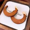 Pendientes de borla con carcasa de madera marrón transfronterizos europeos y americanos, pendientes de estilo vintage Maillard, pendientes de mujer de lujo ligero de alta gama
