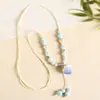 Collar con colgante de campana de mariposa de cerámica de estilo étnico retro para mujer, diseño nuevo y moderno, cadena larga para suéter, accesorios