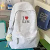 Mochila azul marino de color claro contrastante con textura tejida para estudiantes, estilo universitario americano, adecuada para uso diario casual, viajes y escuela